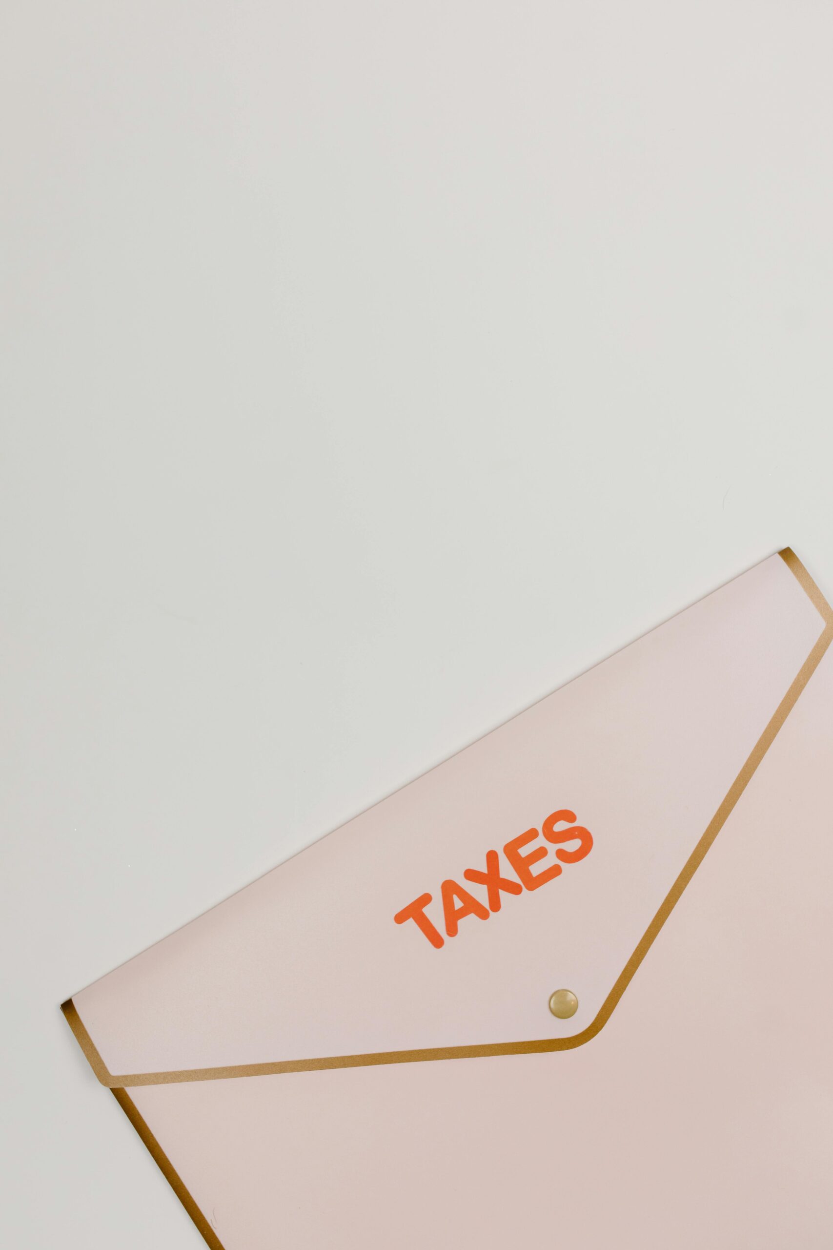 A simple and elegant image of a taxes labeled envelope on a white background, perfect for financial themes.